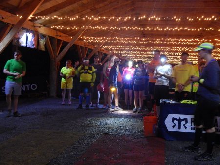 Runners with headlamps in transition area at Ragnar Trail